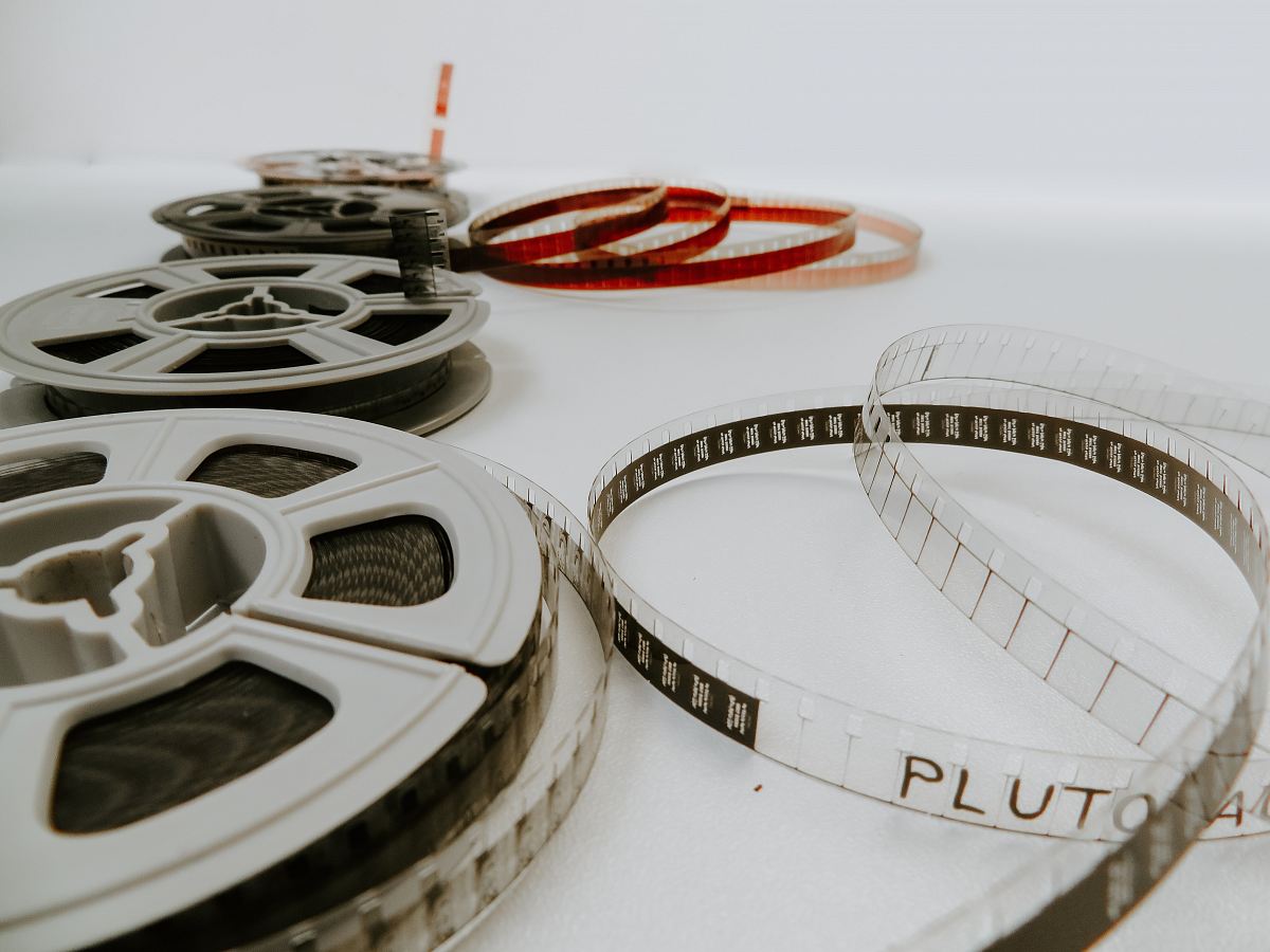 four reel films lying on white table