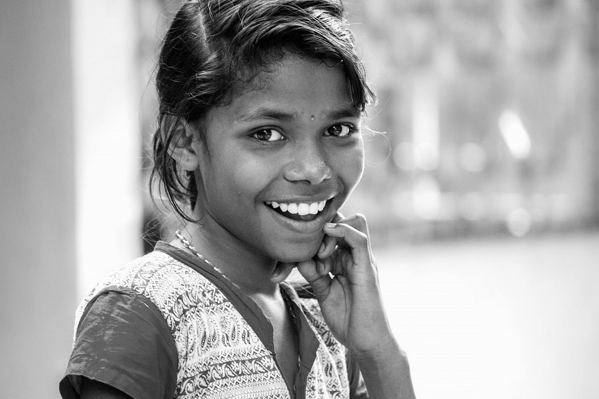 grayscale photography of smiling girl