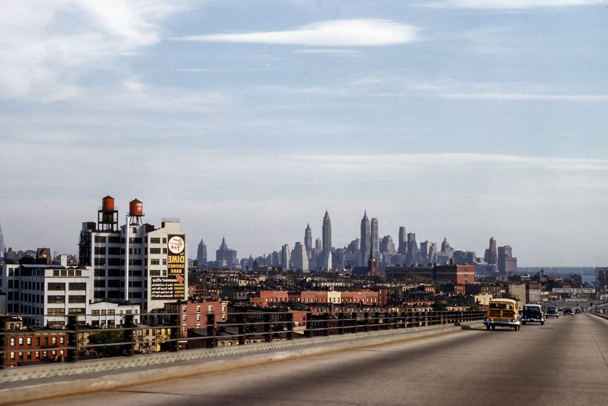 landscape photo of buildings near fly over during daytime