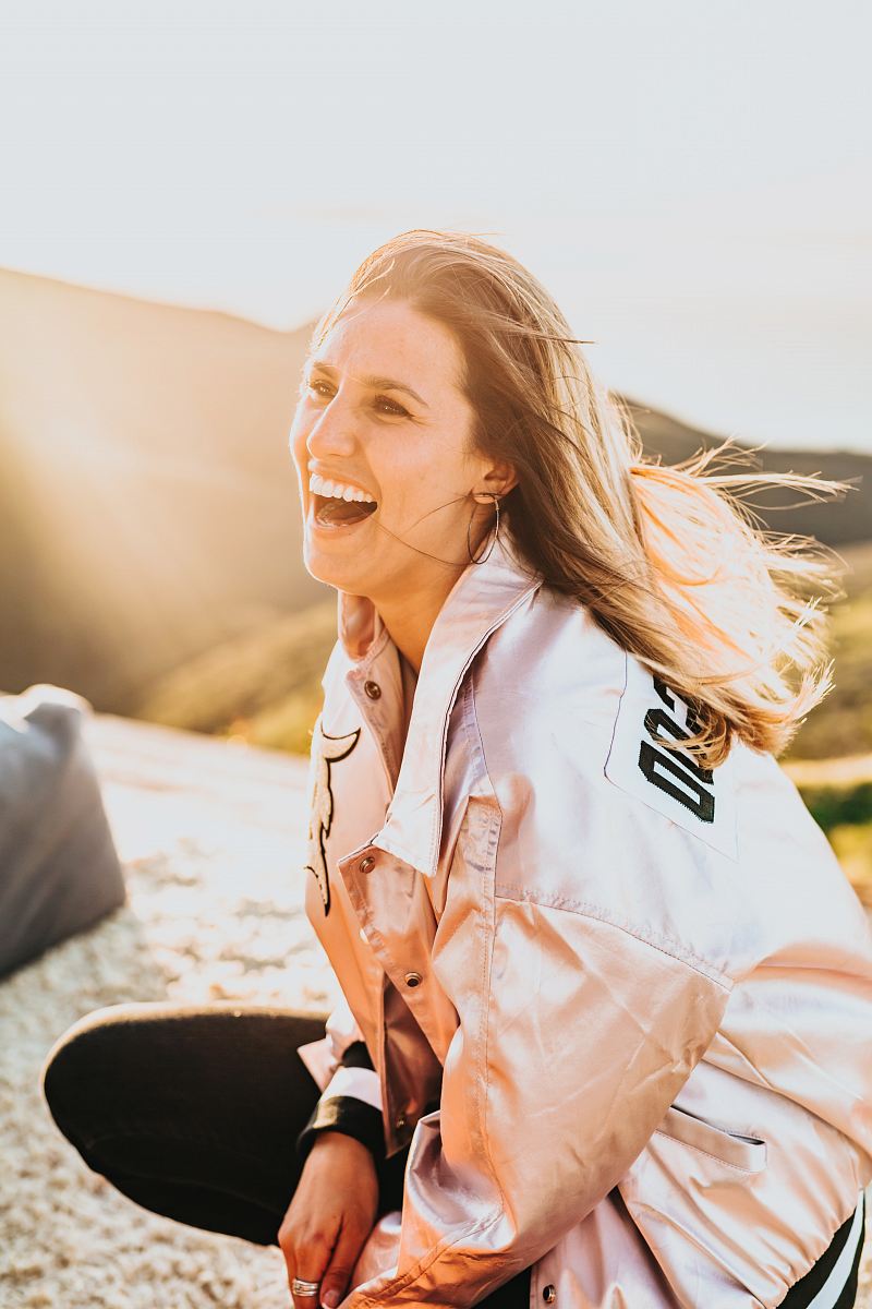 laughing woman while squatting