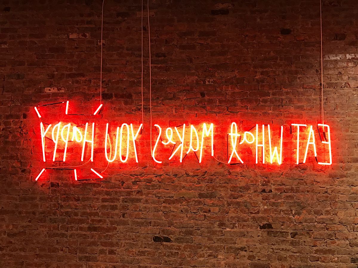 lighted eat what makes you happy neon signage