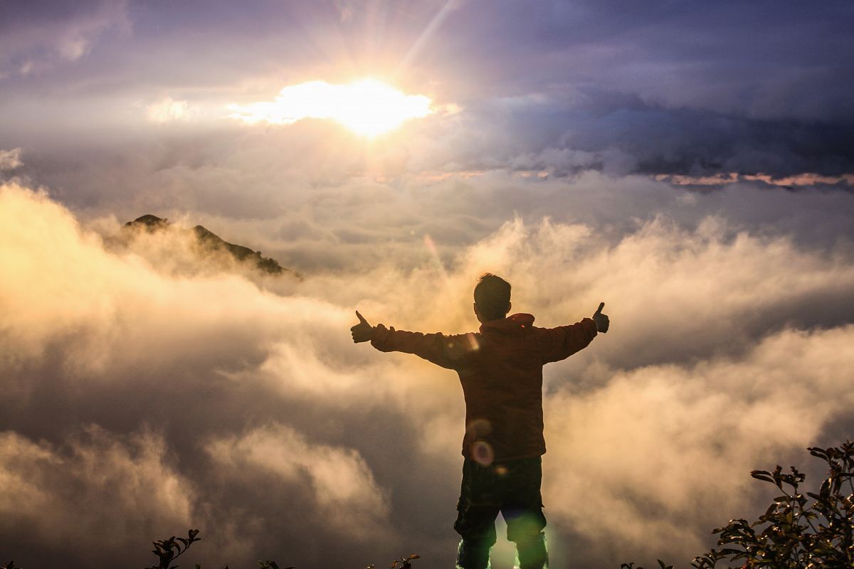 man facing clouds during golden time