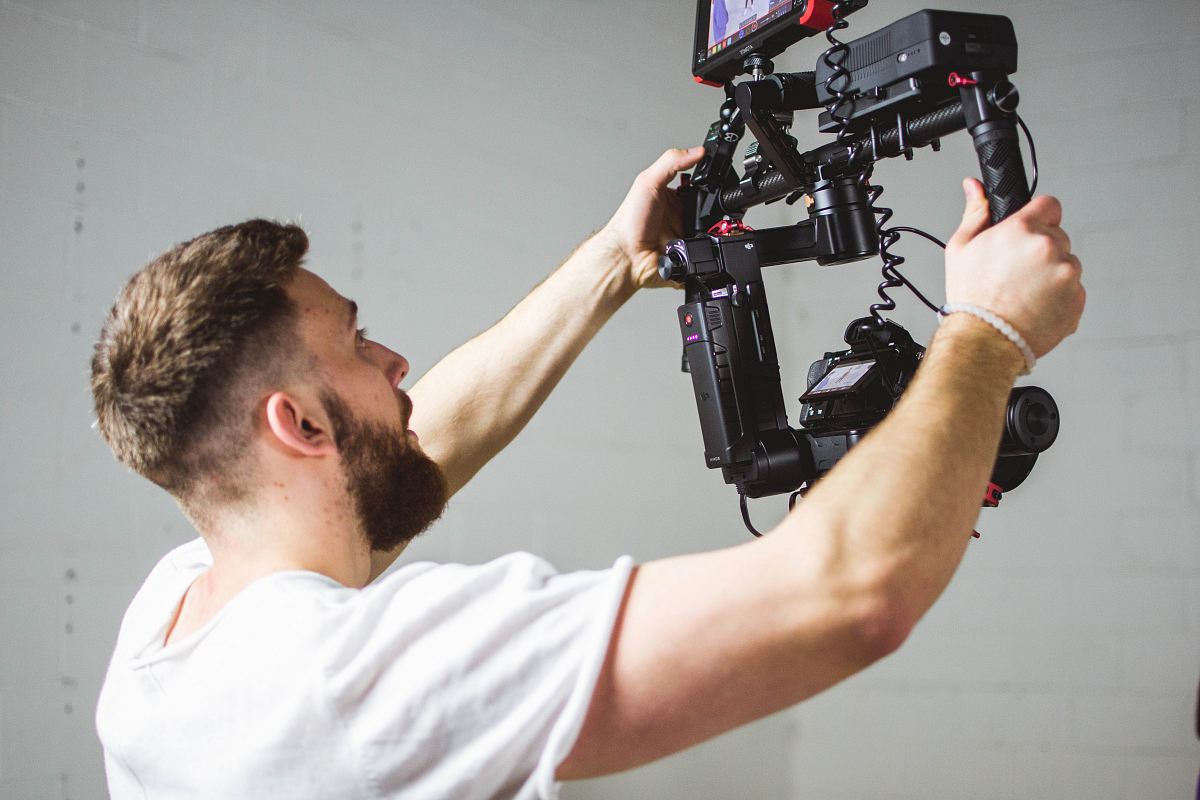 man holding camera with stabilizer