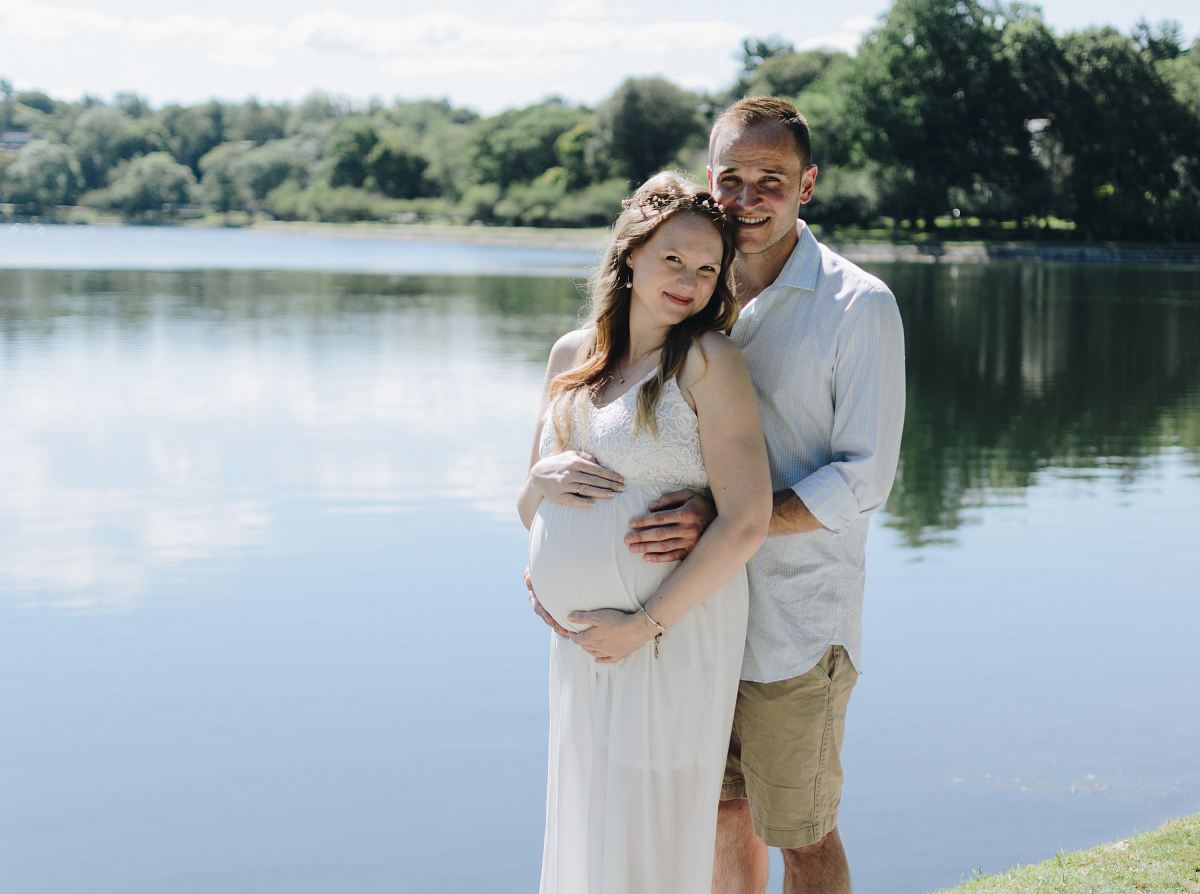 man holding woman tummy