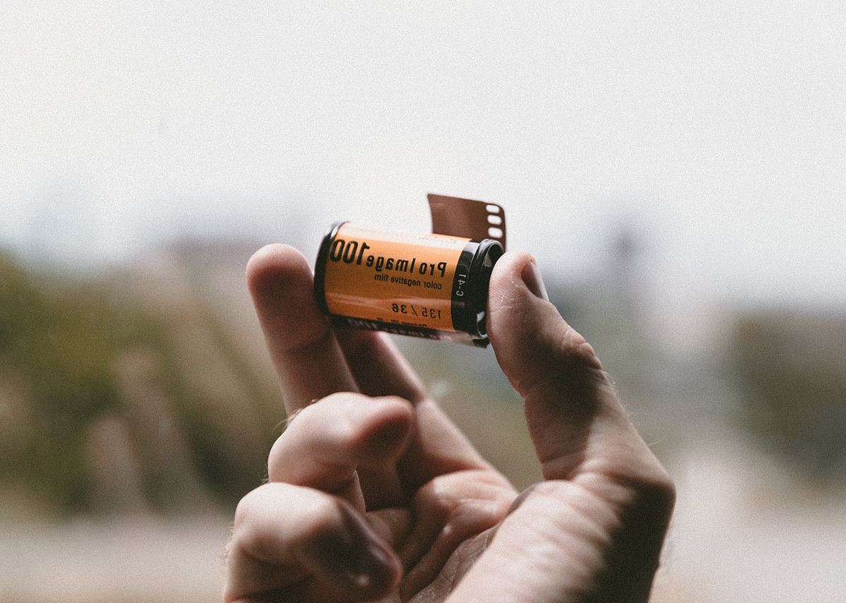 person holding Pro Image 100 tape
