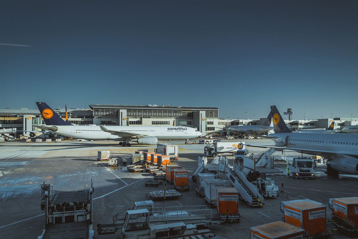 photo of white airliner on port
