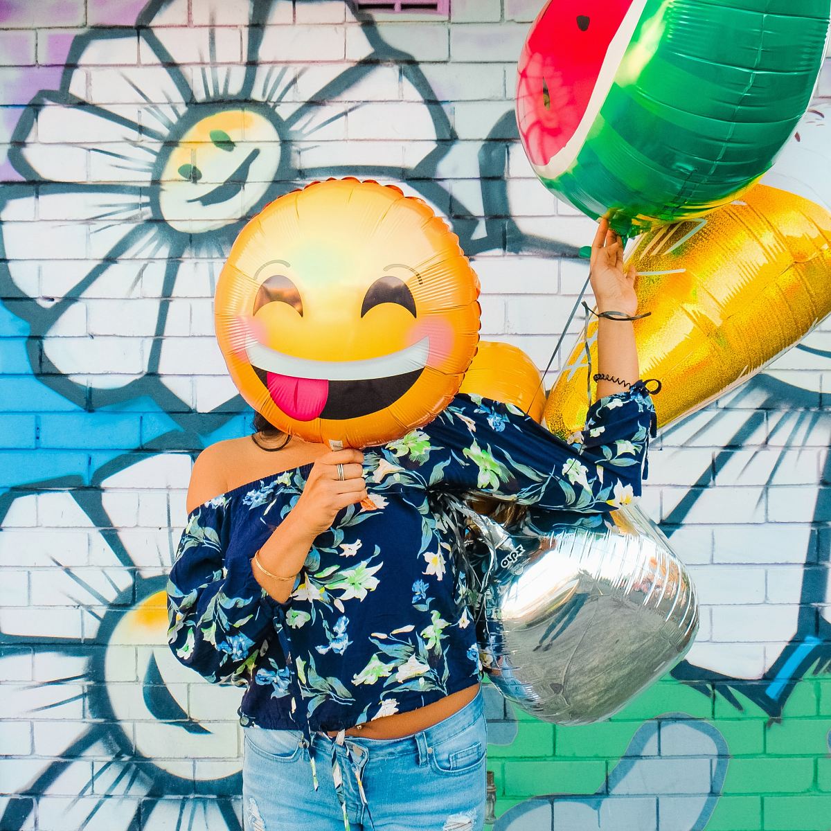 woman holding balloons
