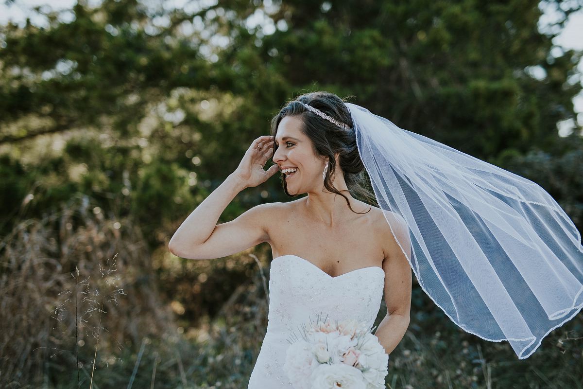 women's white wedding gown near grass