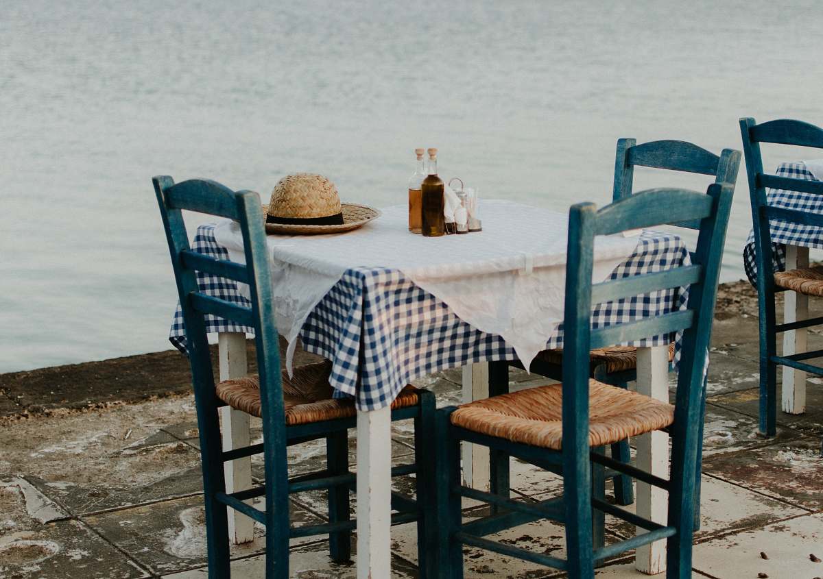 furniture brown sun hat on top of table near calm water table
