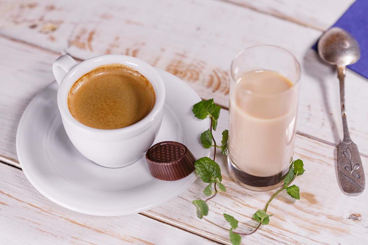 cup white ceramic teacup set and glass of milk on table beverage