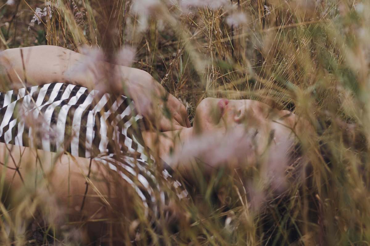 bird woman lying on grass animal