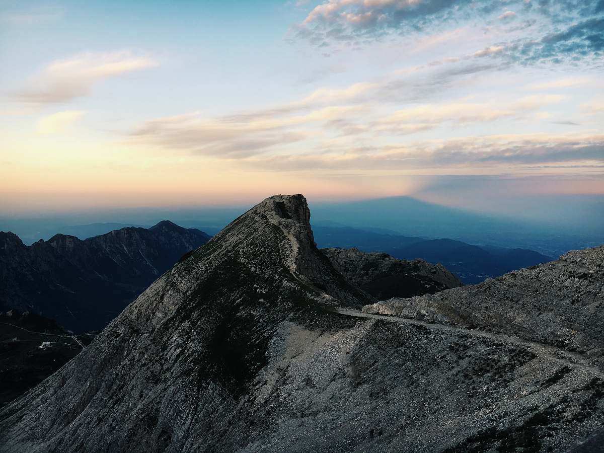 mountain aerial photography of mountain range during golden hour crest
