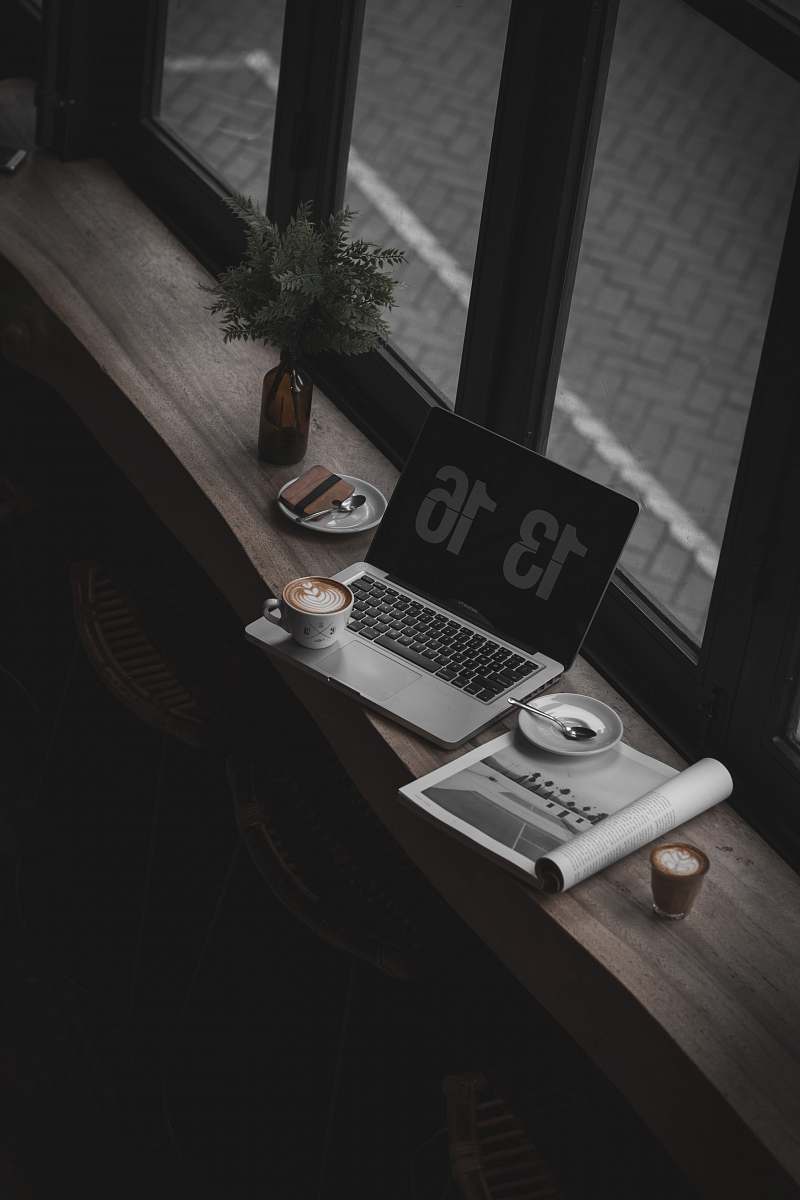 laptop gray laptop computer near window electronics
