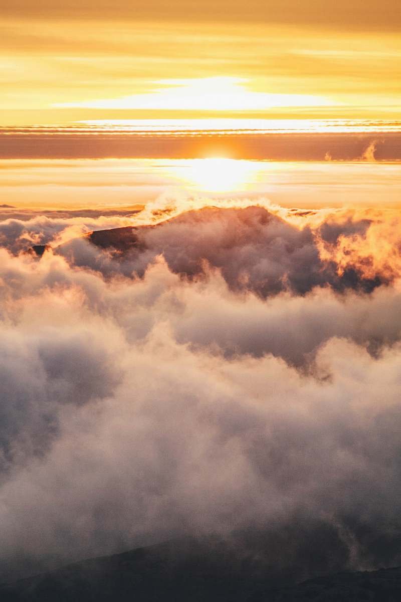 cloud mountain covered in clouds during golden hour nature
