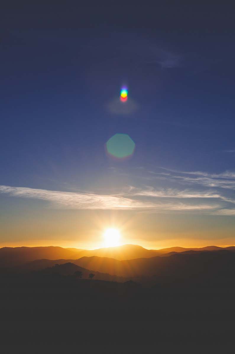 sun silhouette of mountain during sunset outdoors