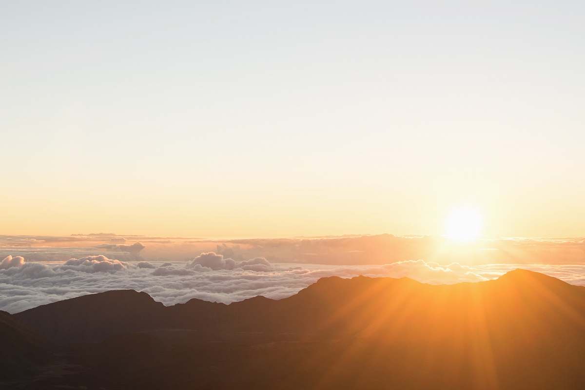 sky mountain range under golden hour sunrise
