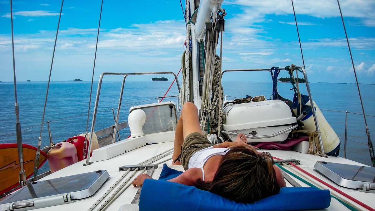 transportation woman lying on top of the boat boat