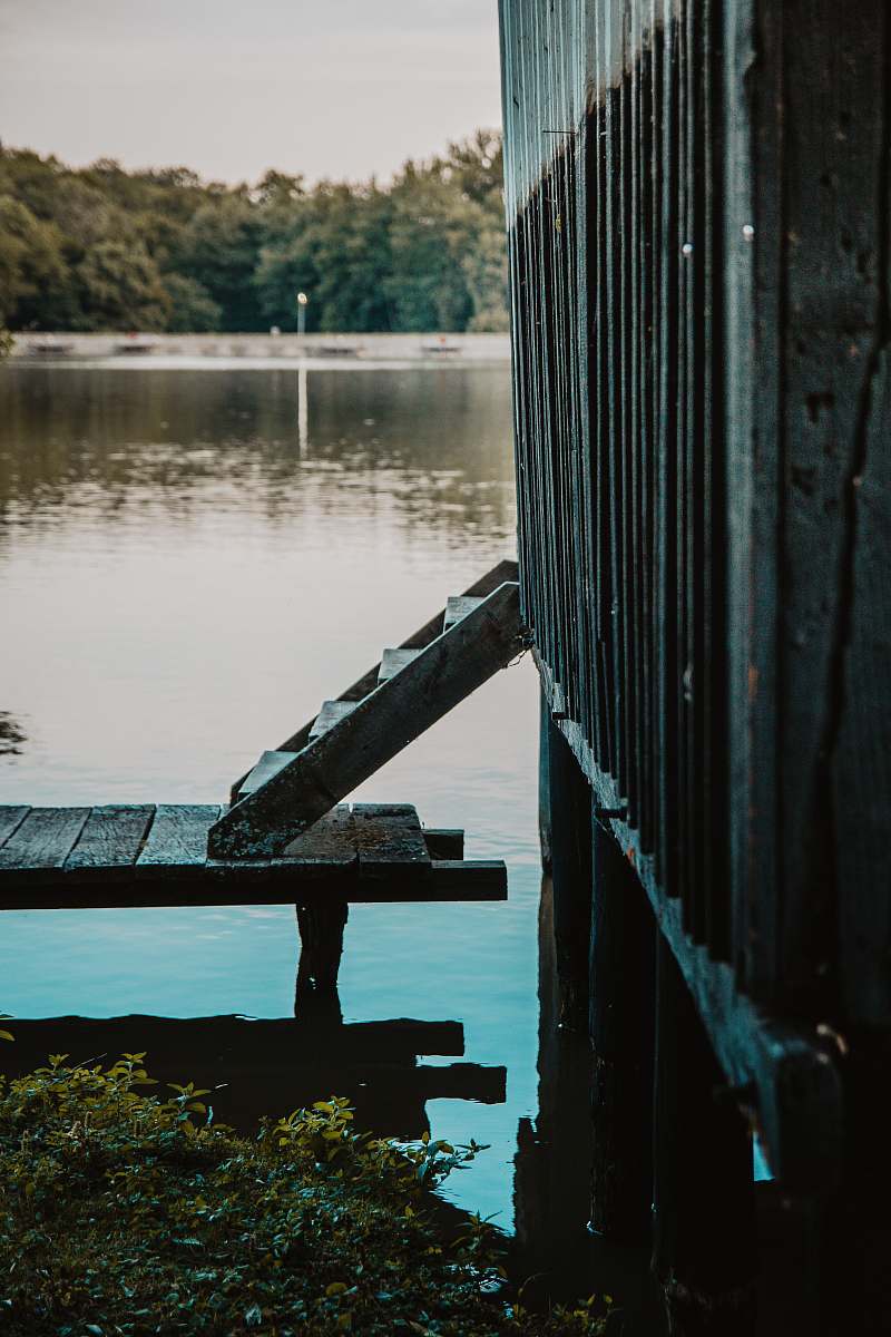 waterfront gray wooden dock beside body of water close-up photography dock