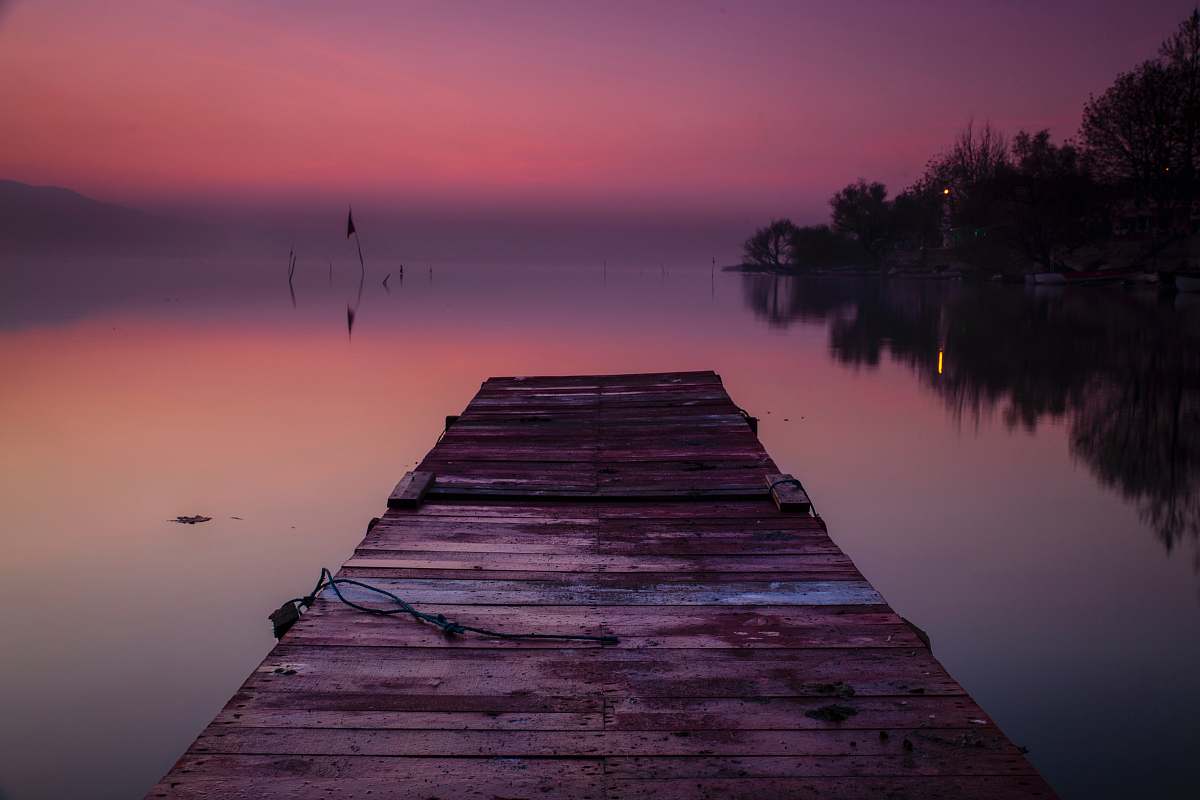 waterfront wooden dock during golden hour pier