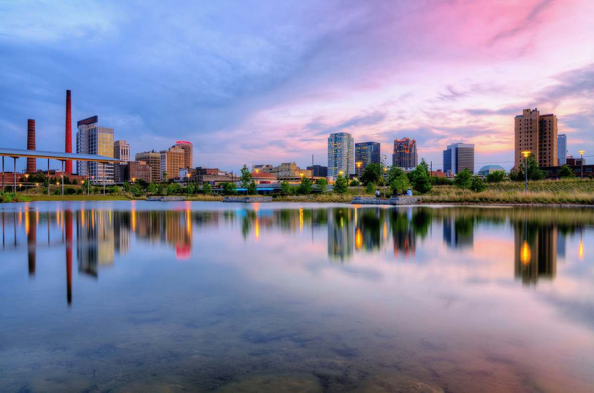 building landscape photography of cityscape by water reflection