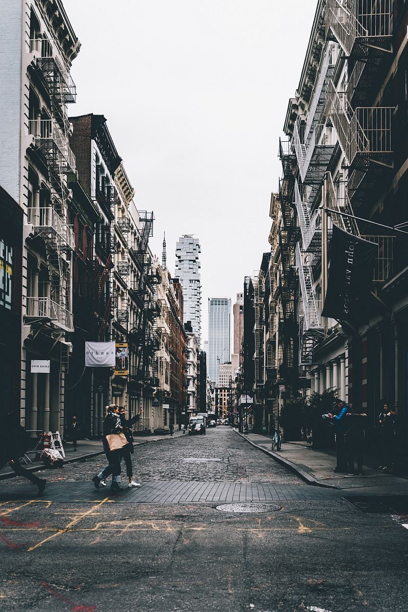 Capture the vibrant energy of city life with this dynamic street scene featuring a diverse crowd of pedestrians strolling past modern and classic buildings. Perfect for use in travel blogs, urban lifestyle articles, and promotional materials for city events, this image encapsulates the essence of daily life in a bustling metropolis.