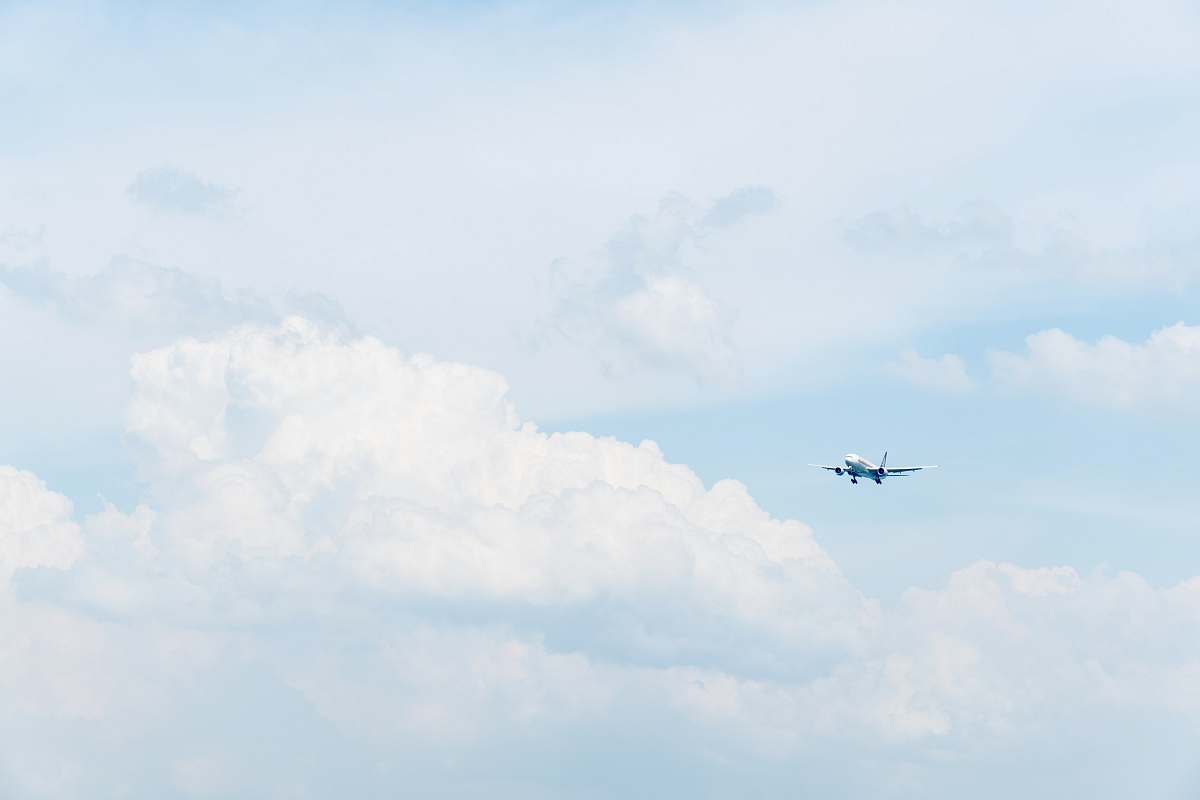 Capture the essence of travel and freedom with this breathtaking blue photo featuring a white commercial airplane gracefully flying through a clear sky dotted with fluffy white clouds. This image is perfect for travel blogs, aviation-related websites, or marketing materials for airlines and travel agencies. Its vibrant colors and dynamic composition evoke a sense of adventure and wanderlust, making it an ideal choice for anyone looking to inspire journeys and exploration.