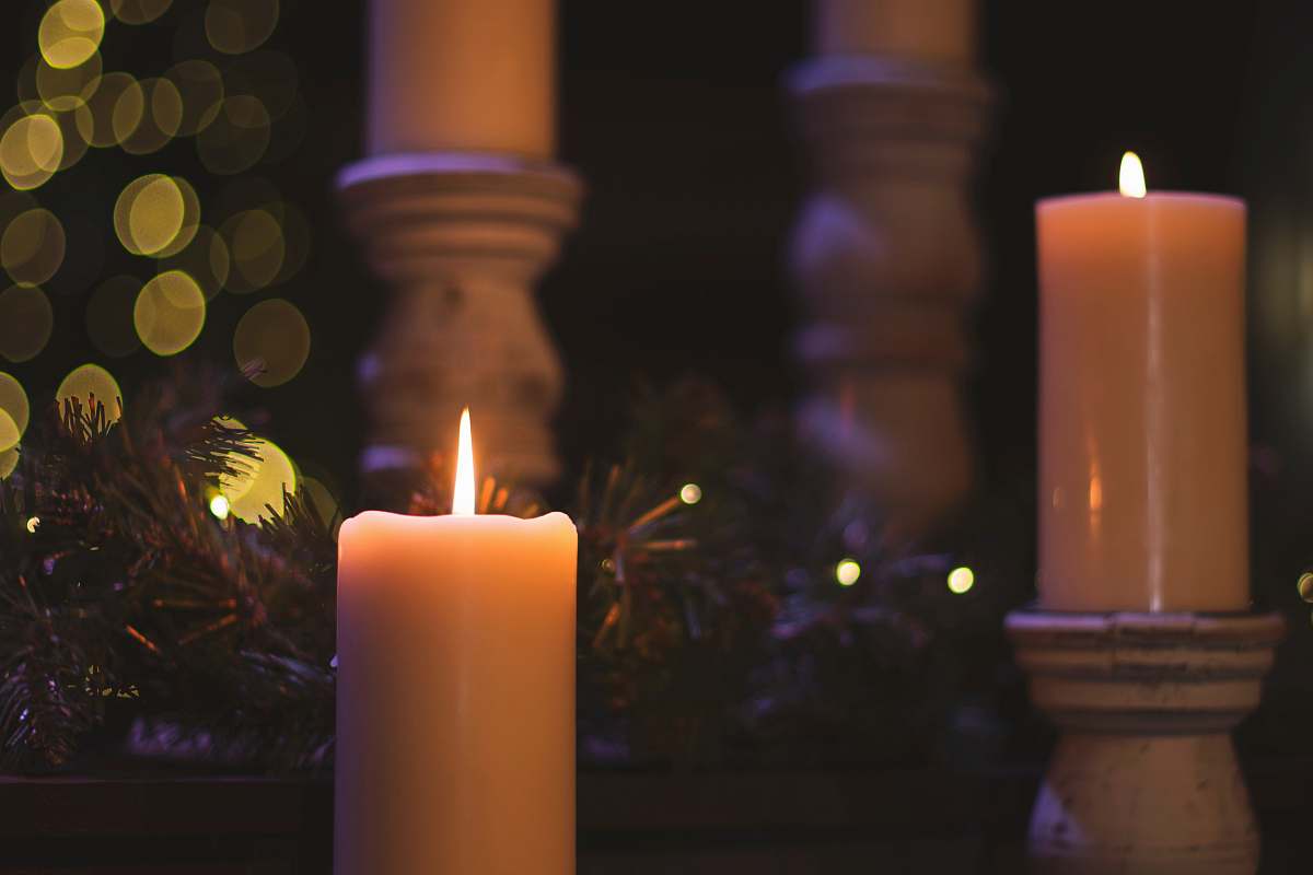 fire lighted pillar candles christmas