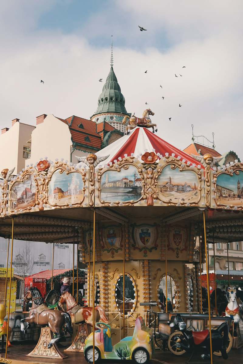 building carousel ride under bright sky amusement park