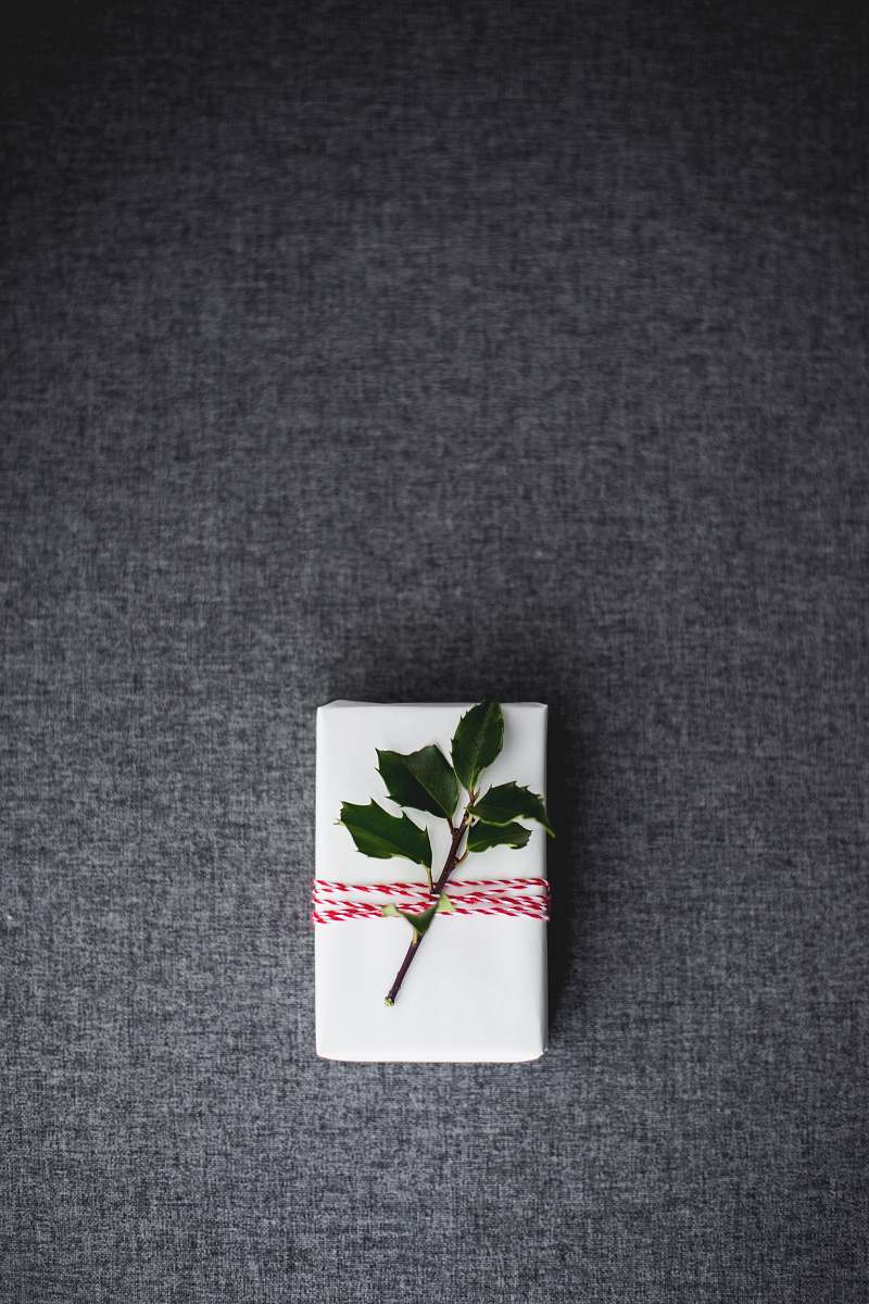 holiday green leaves on white box placed on gray textile grand rapids