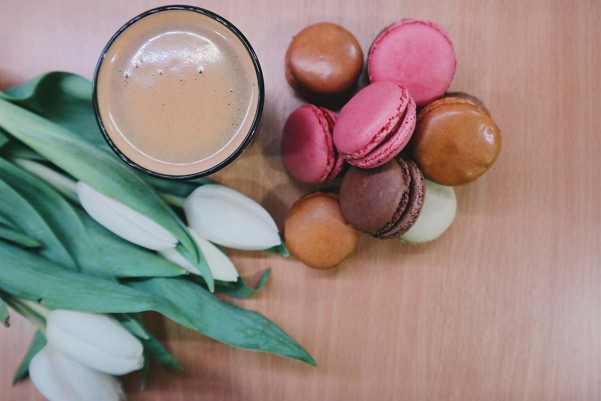food assorted-color macaroon near bowl flowers