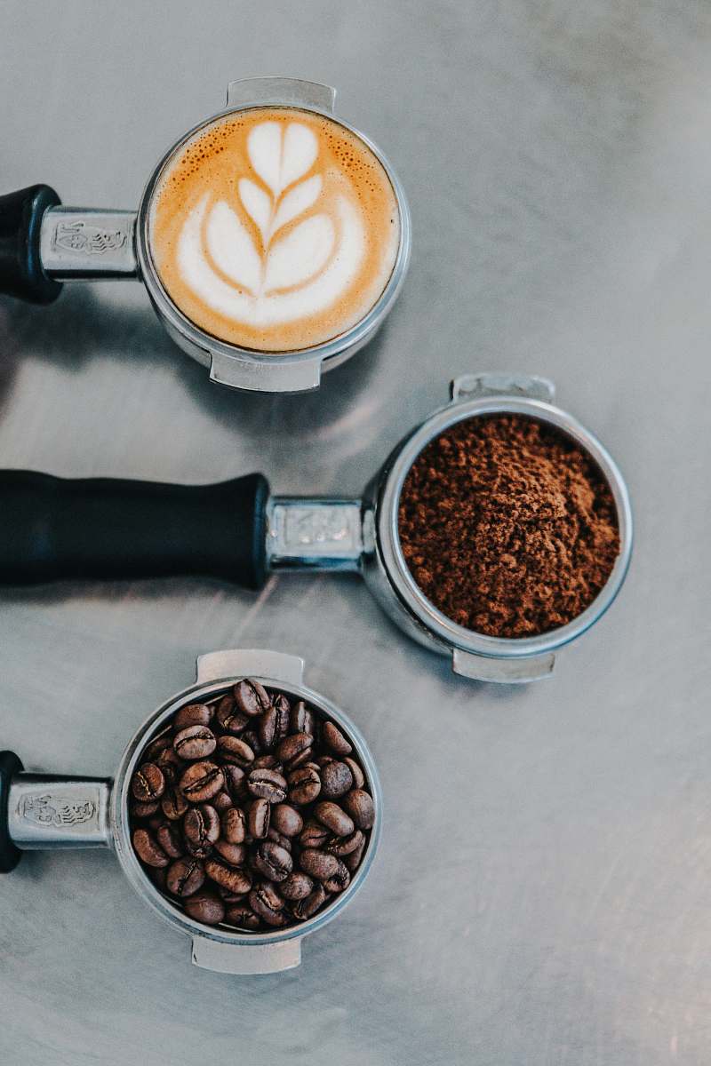 food flat lay photography of coffee latte, ground coffee, and coffee beans vegetable