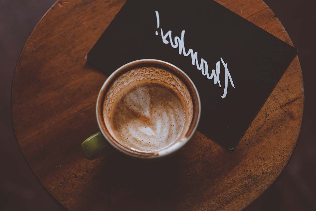 cup flat lay photography of coffee latte in teacup on table drink