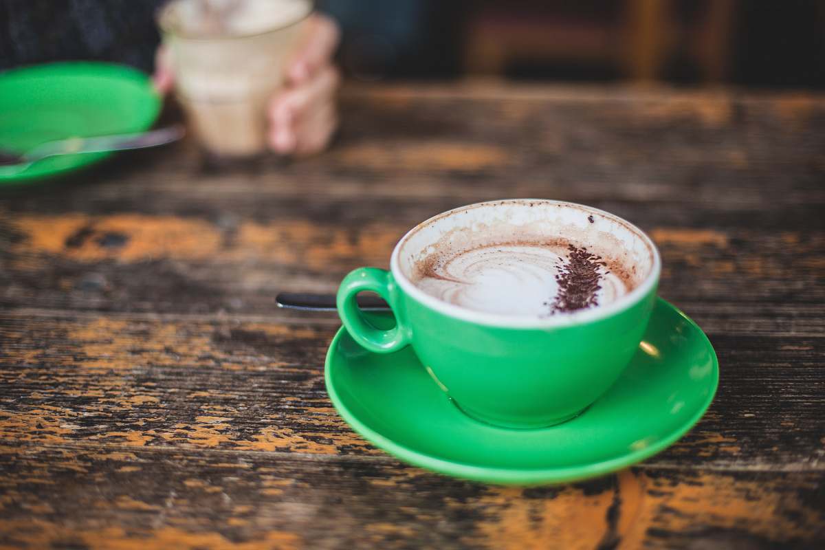 drink shallow focus photography of green teacup with coffee inside green