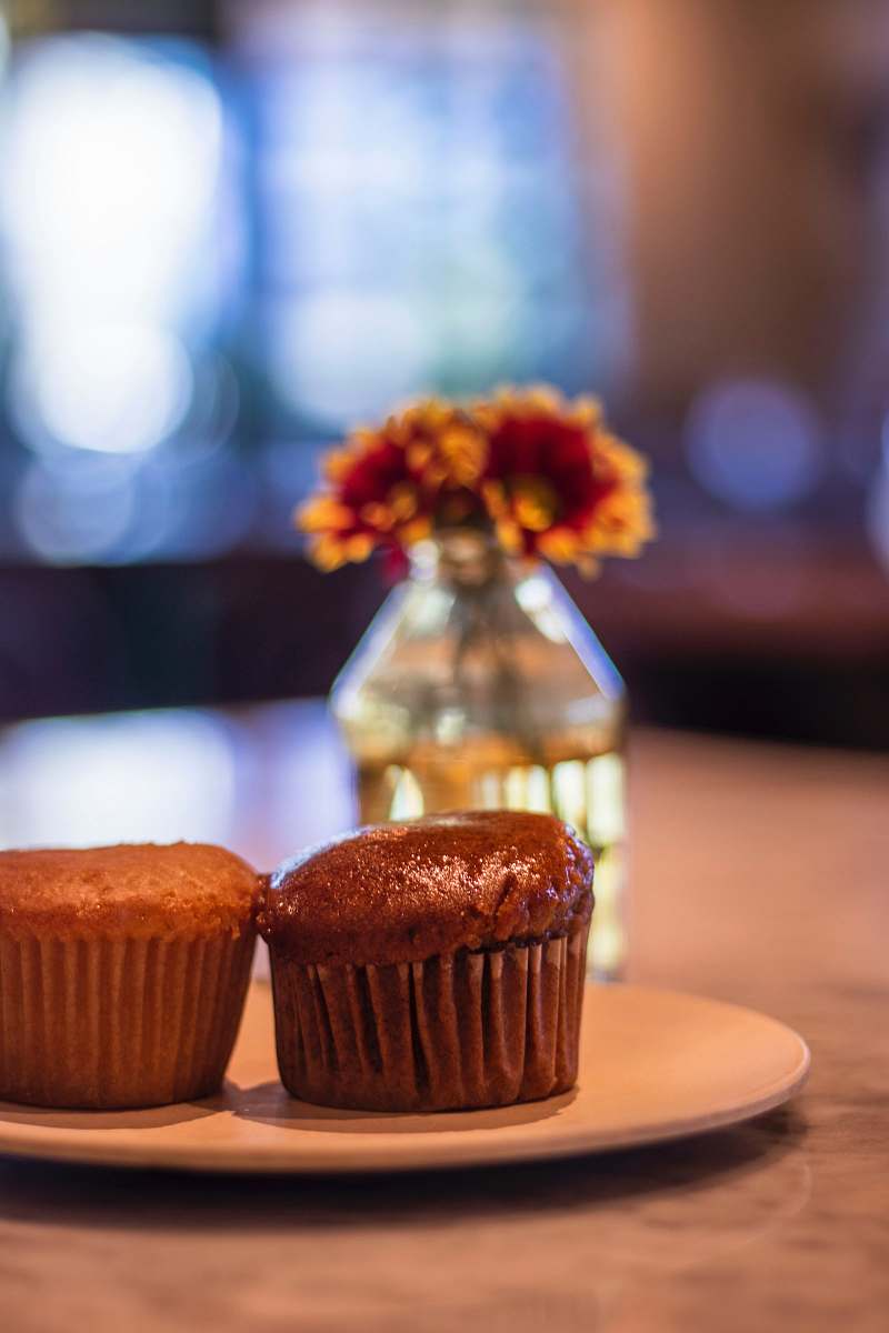 dessert cupcake on round brown plate creme