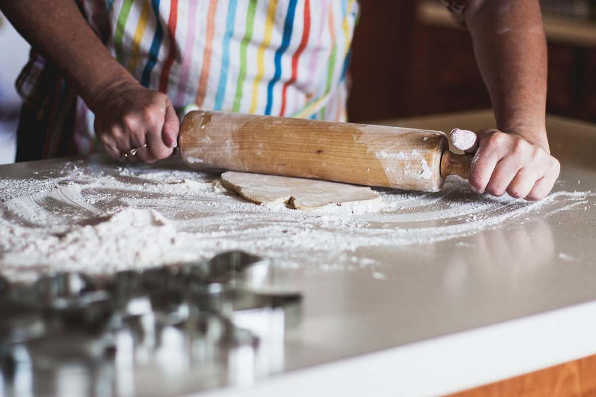 food person holding rolling pin person
