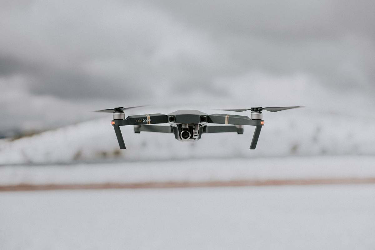 black-and-white closeup photo of gray quadcopter grey