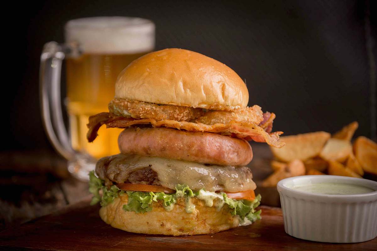 burger burger beside sauce container brown