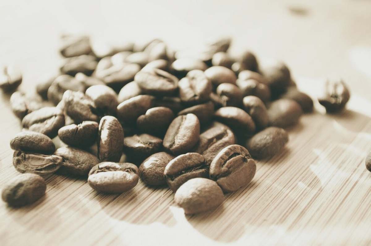 bean coffee beans on brown surface coffee beans