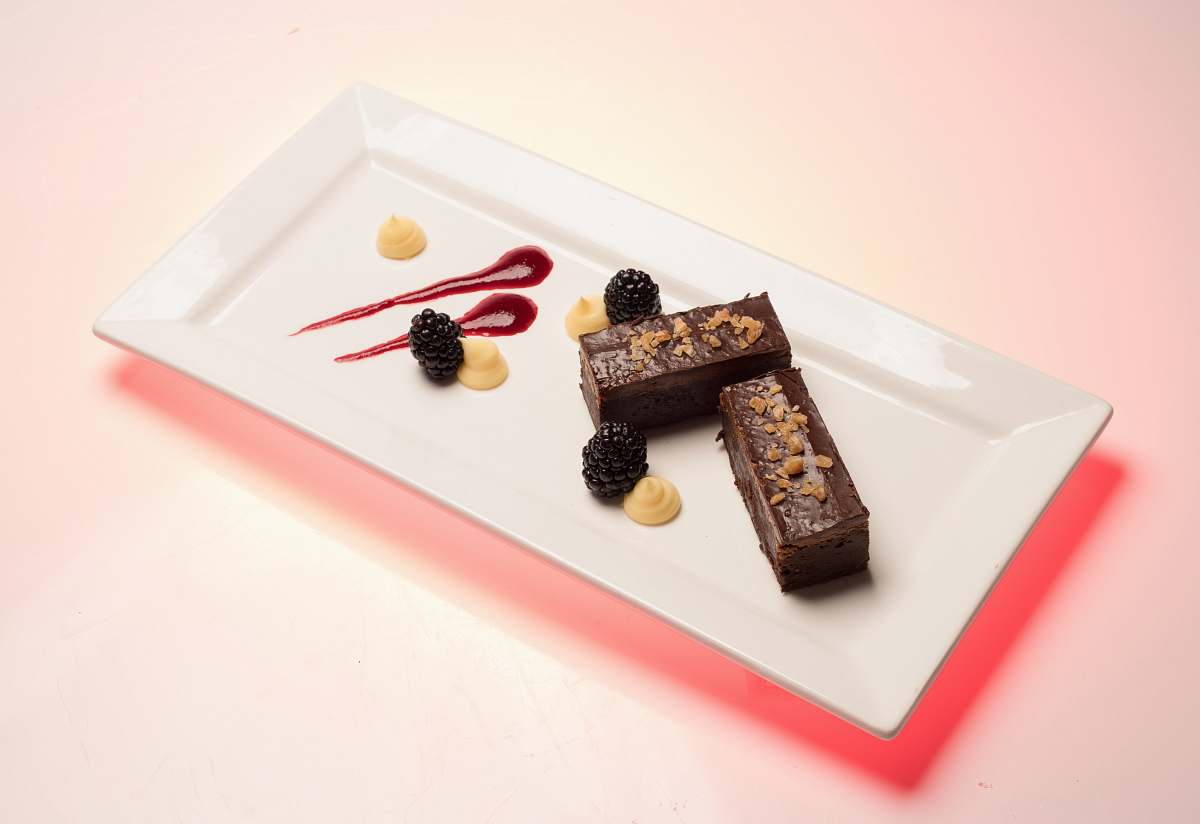 dessert rectangular white ceramic plate with cakes chocolate