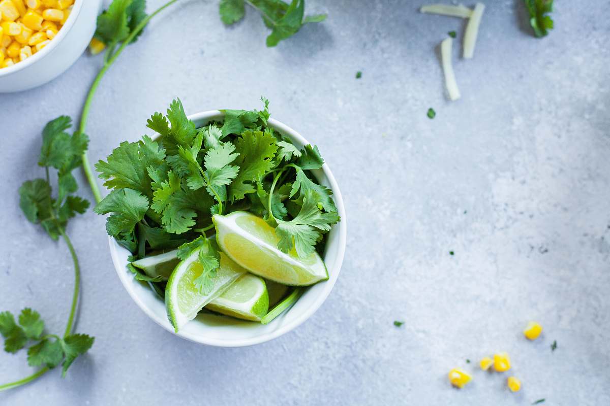 parsley sliced lime in white ceramic bowl jar