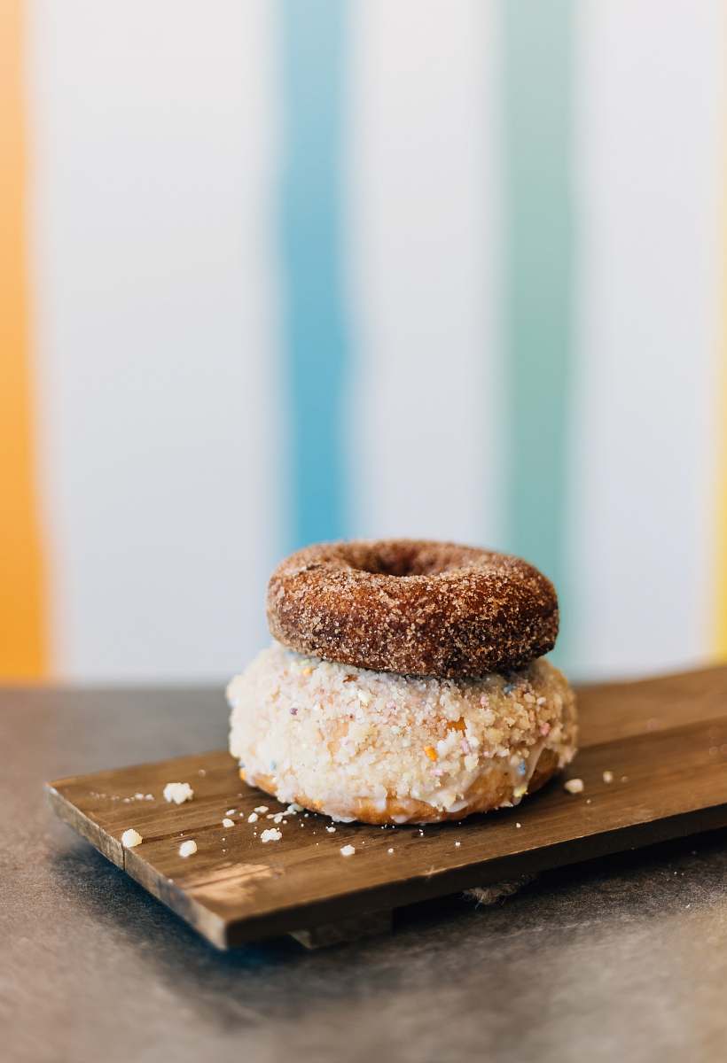 bread two donuts on wooden tray dessert