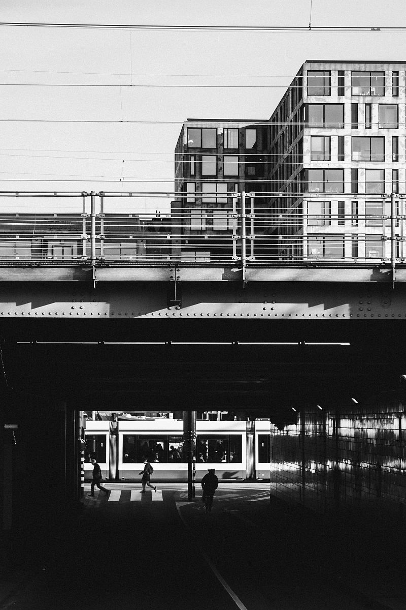 grayscale photograph of train bridge