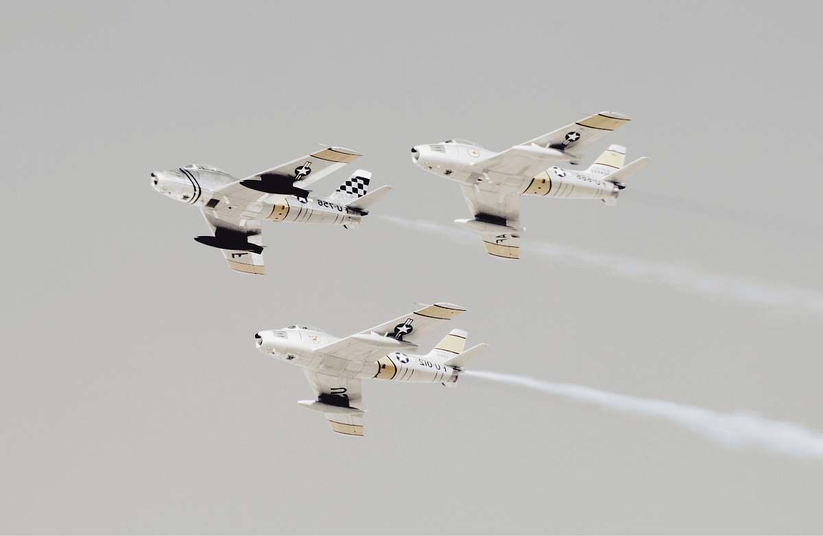 flight three white-and-black jet planes aircraft
