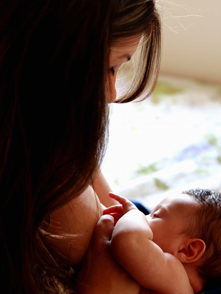 newborn woman carries baby person