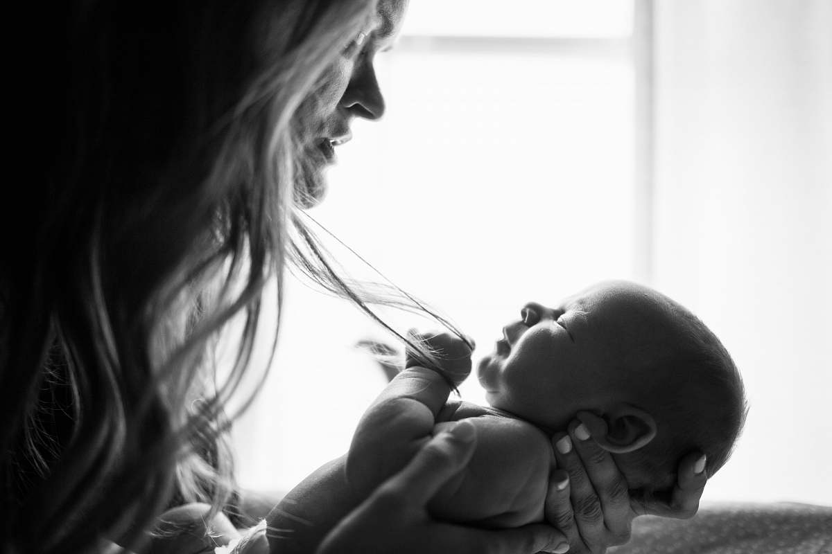 baby woman holding baby black-and-white