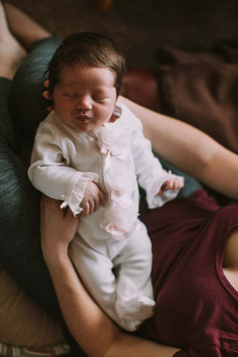 person woman holding baby baby