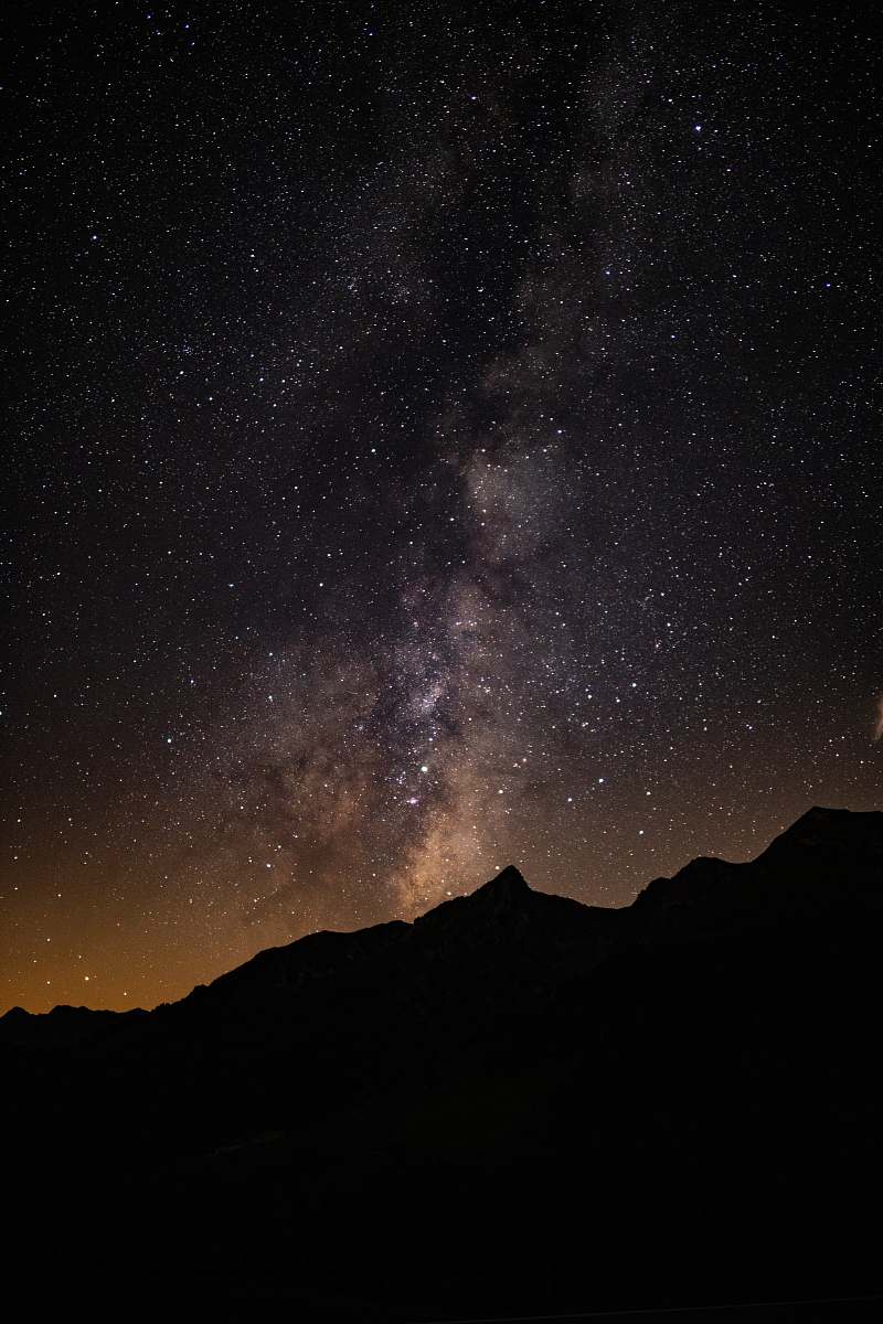 nature silhouette of mountain under starry sky outdoors