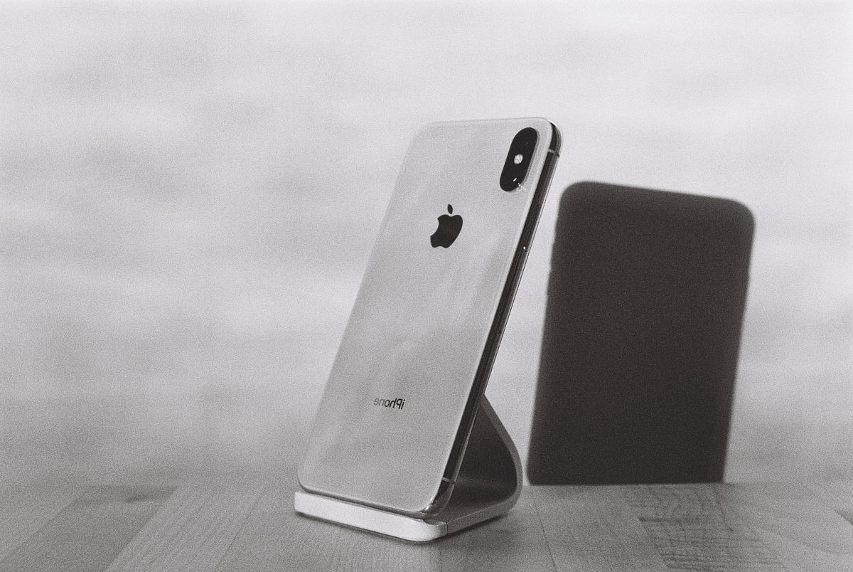 silver iPhone X on stand