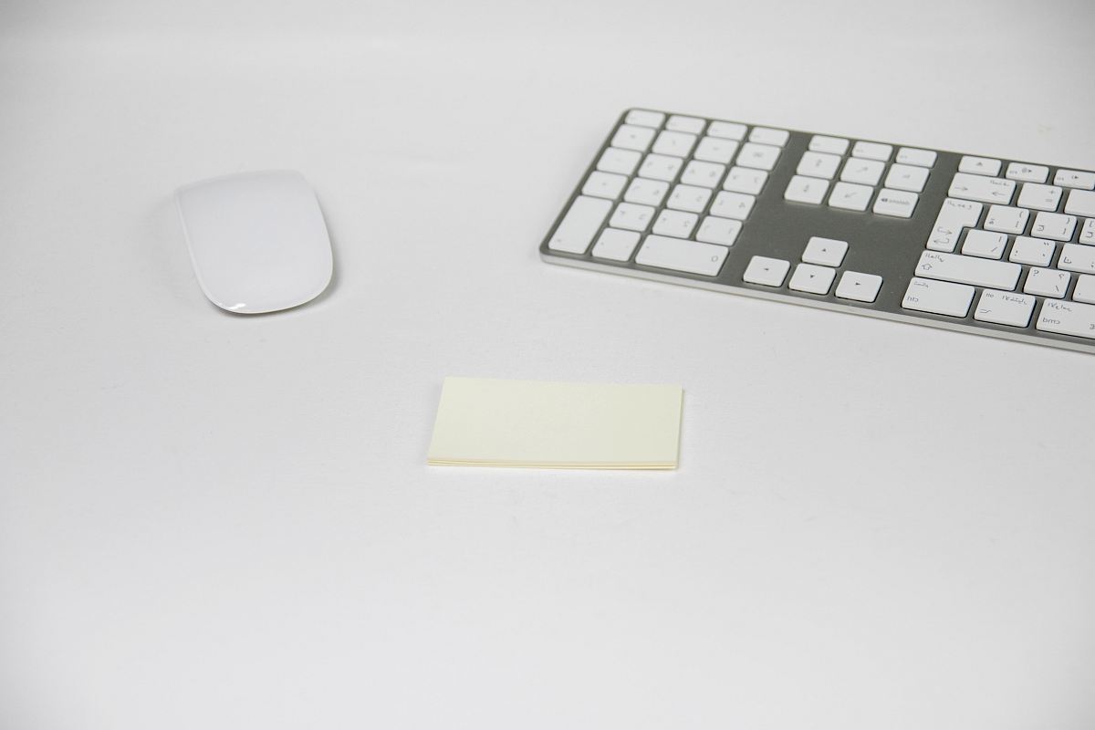two white Apple Magic Mouse and Keyboard