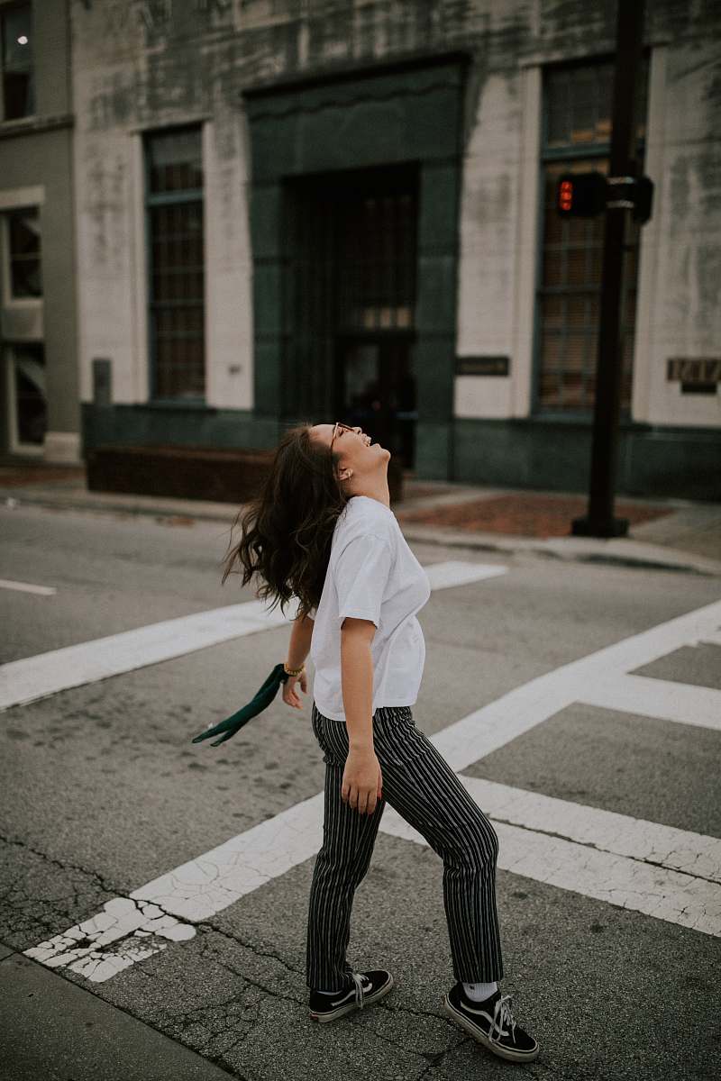 tarmac woman standing on road's pedestrian lane road
